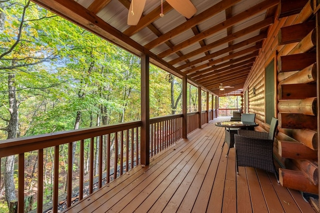 wooden deck featuring ceiling fan