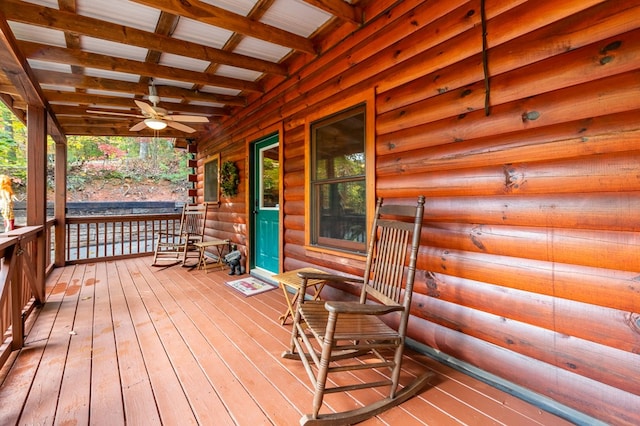 deck featuring a porch and ceiling fan