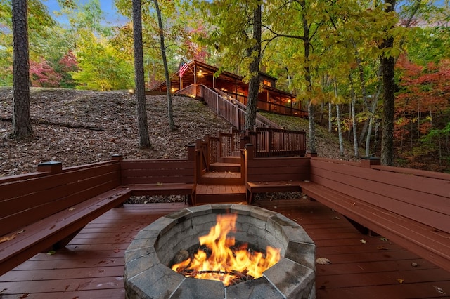 wooden deck with a fire pit