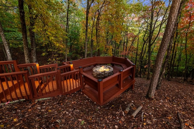 deck featuring an outdoor fire pit