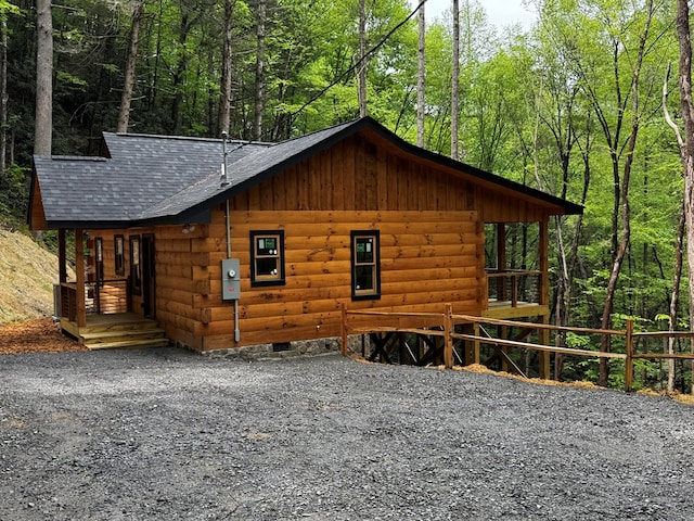 122 Laurel Creek Trl, Blue Ridge, GA 30513 - view of side of home featuring board and batten siding, a forest view, and roof with shingles