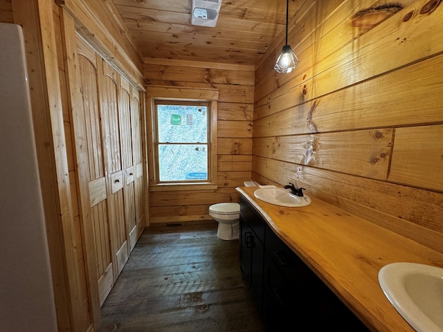 122 Laurel Creek Trl, Blue Ridge, GA 30513 - bathroom featuring wood-type flooring, double vanity, wooden walls, and toilet