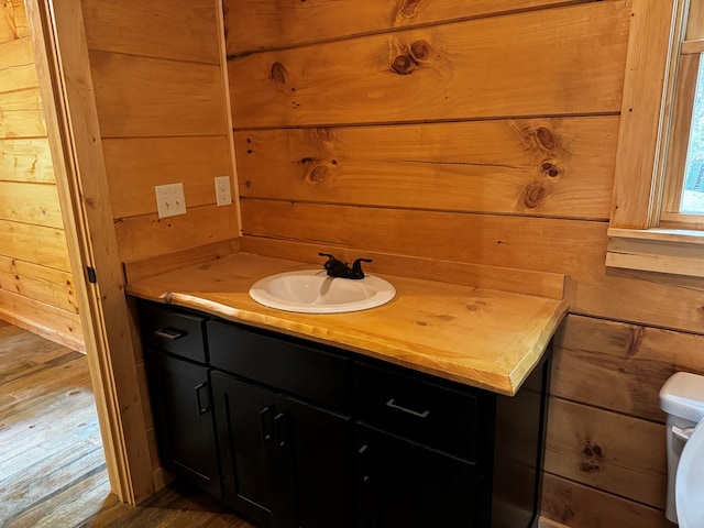 122 Laurel Creek Trl, Blue Ridge, GA 30513 - bathroom with vanity, wood finished floors, wooden walls, and toilet