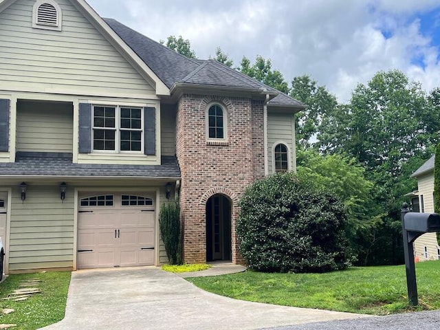 366 Licklog Rdg, Hayesville, NC 28904 - view of front facade featuring a garage, brick siding, concrete driveway, and a shingled roof