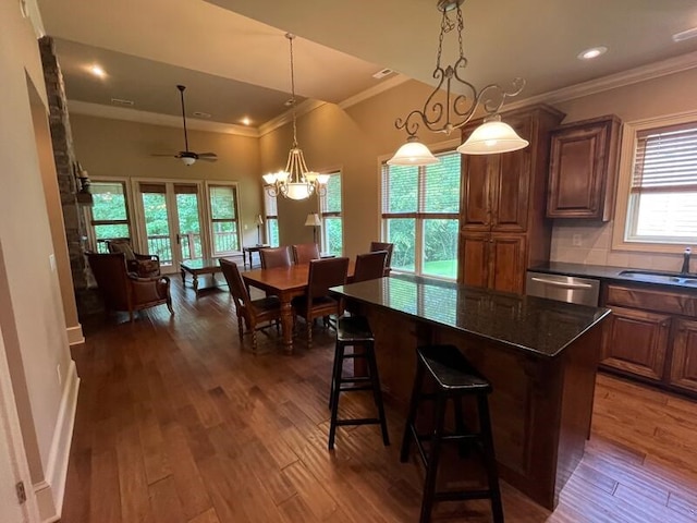366 Licklog Rdg, Hayesville, NC 28904 - kitchen featuring ornamental molding, stainless steel dishwasher, wood finished floors, a breakfast bar area, and a kitchen island