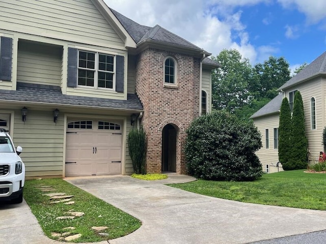 366 Licklog Rdg, Hayesville, NC 28904 - view of front of home with an attached garage, concrete driveway, a front yard, and brick siding