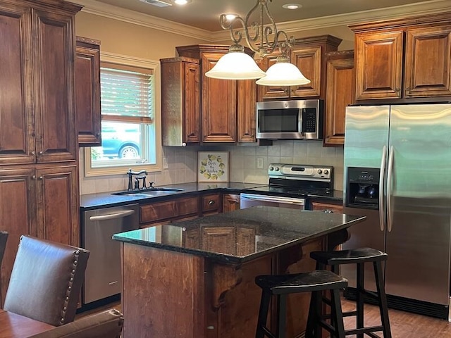 366 Licklog Rdg, Hayesville, NC 28904 - kitchen with stainless steel appliances, a kitchen island, tasteful backsplash, a breakfast bar, and decorative light fixtures
