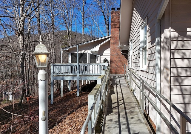 view of property exterior featuring a deck