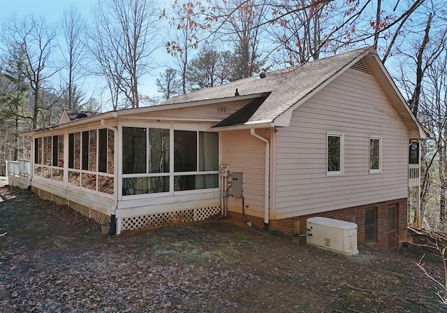 rear view of house with a sunroom