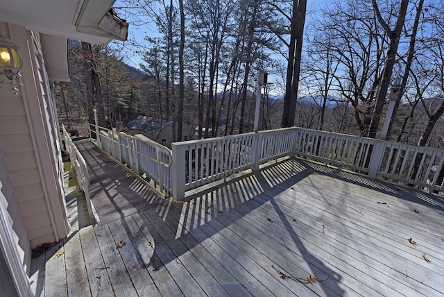 wooden deck with a mountain view