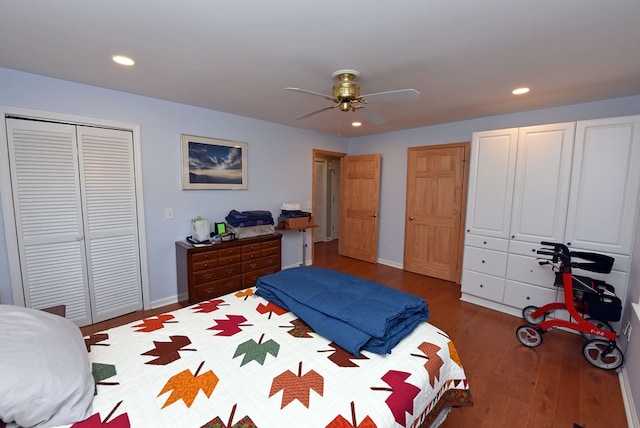 bedroom with dark hardwood / wood-style floors and ceiling fan