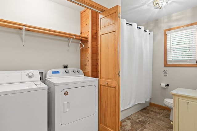 clothes washing area with independent washer and dryer