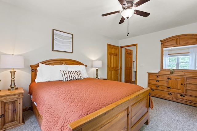 bedroom featuring light carpet and ceiling fan