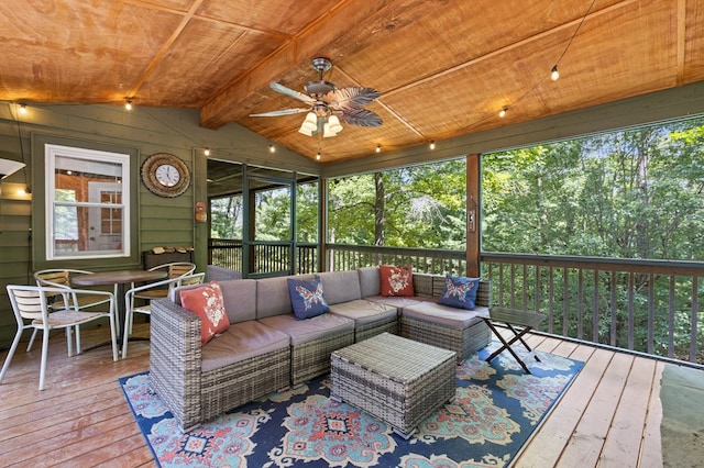 sunroom / solarium with vaulted ceiling with beams, wooden ceiling, and ceiling fan