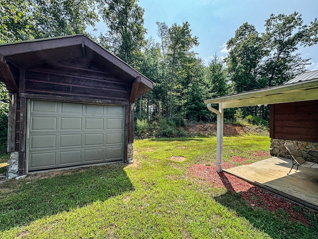 garage featuring a lawn