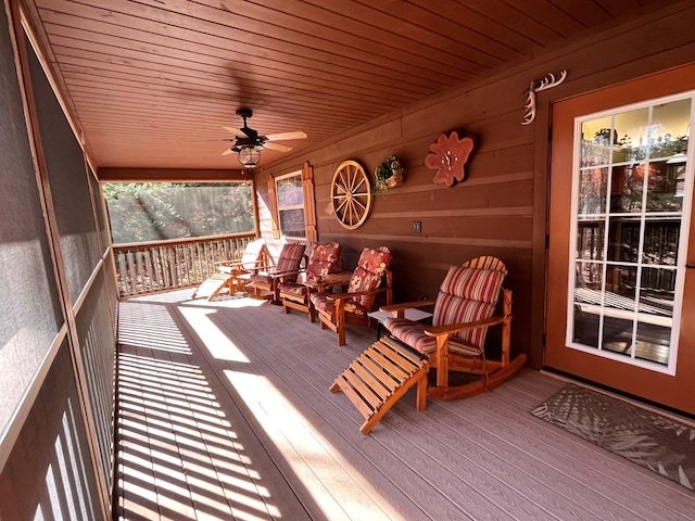 deck featuring a porch and ceiling fan