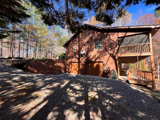 view of side of home with a garage