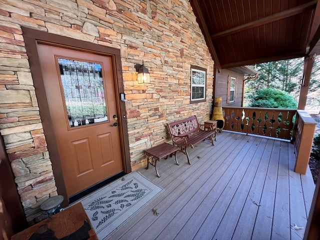 199 Orlon Dr, East Ellijay, GA 30540 - property entrance with stone siding and a wooden deck