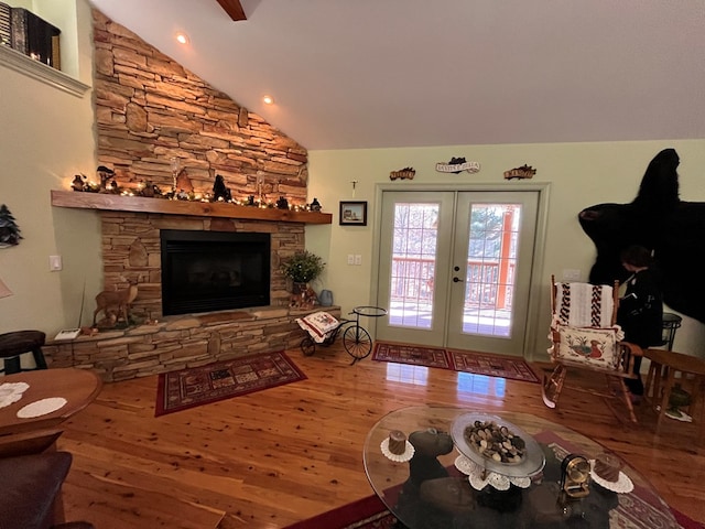 199 Orlon Dr, East Ellijay, GA 30540 - living room featuring wood finished floors, french doors, lofted ceiling, and a stone fireplace