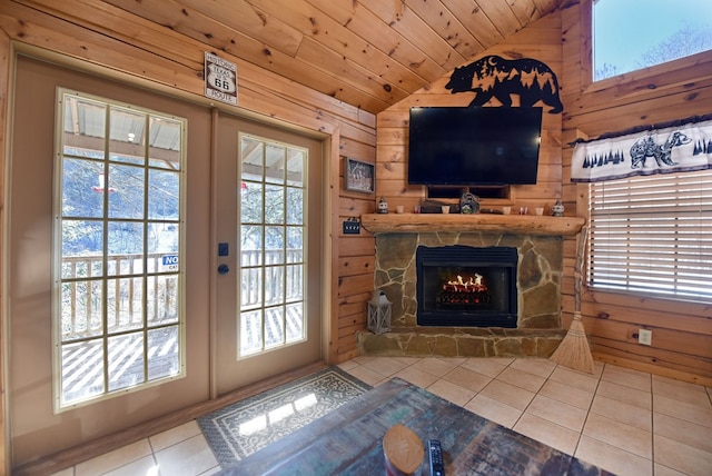 doorway featuring wooden ceiling, tile patterned floors, lofted ceiling, and wooden walls