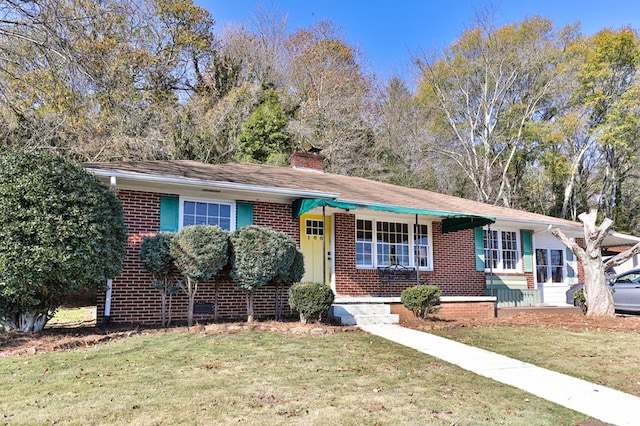 ranch-style home with a front lawn