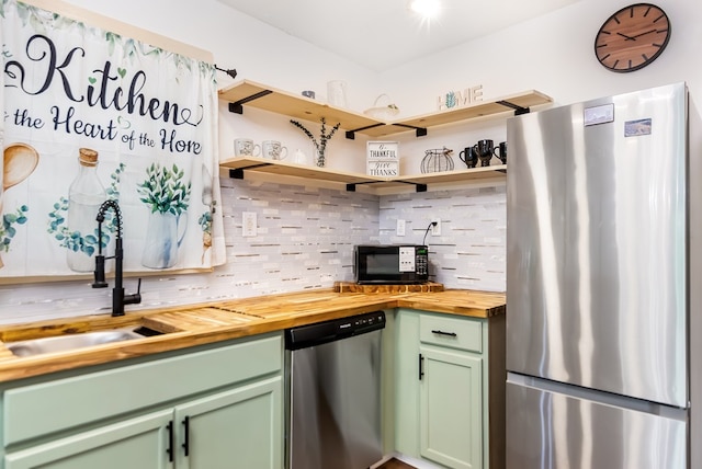 338 Canter Ct, Ellijay, GA 30540 - kitchen with stainless steel appliances, green cabinetry, butcher block counters, and decorative backsplash