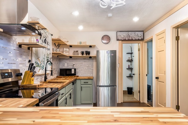 338 Canter Ct, Ellijay, GA 30540 - kitchen with appliances with stainless steel finishes, butcher block counters, green cabinetry, island range hood, and tasteful backsplash