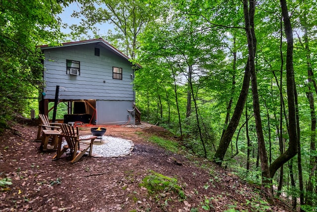 338 Canter Ct, Ellijay, GA 30540 - back of property featuring an outdoor fire pit