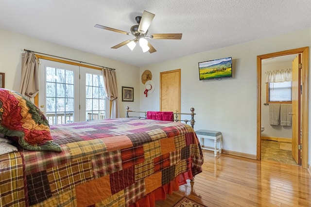 bedroom featuring access to exterior, ceiling fan, baseboards, hardwood / wood-style floors, and a textured ceiling