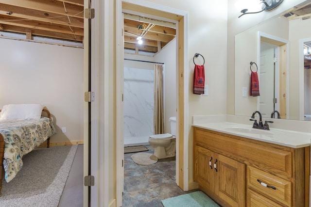 full bathroom featuring a shower stall, toilet, and vanity