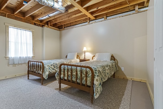 carpeted bedroom featuring baseboards