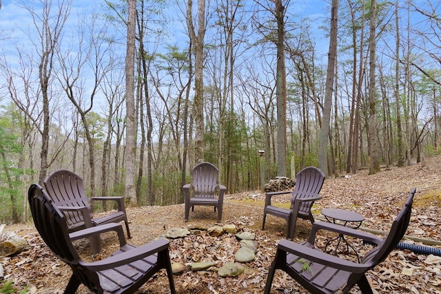 view of yard with a forest view