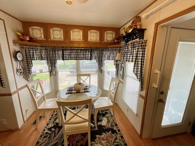 dining area with wood-type flooring