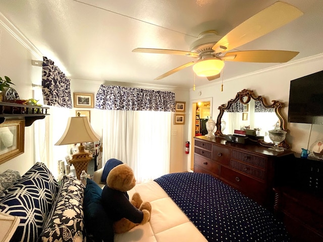 bedroom featuring crown molding, multiple windows, and ceiling fan