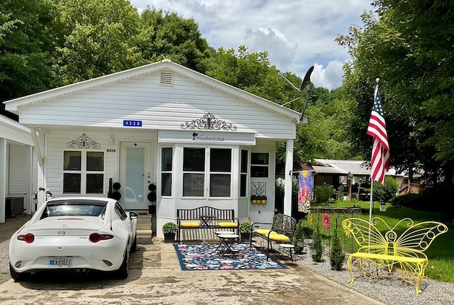 view of front of home featuring central air condition unit and covered porch