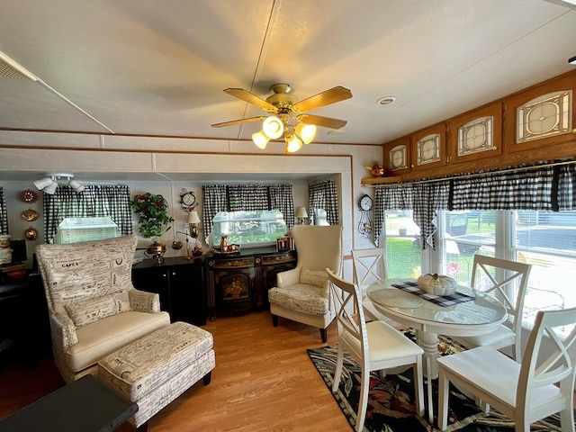 dining space featuring ceiling fan, plenty of natural light, and light wood-type flooring