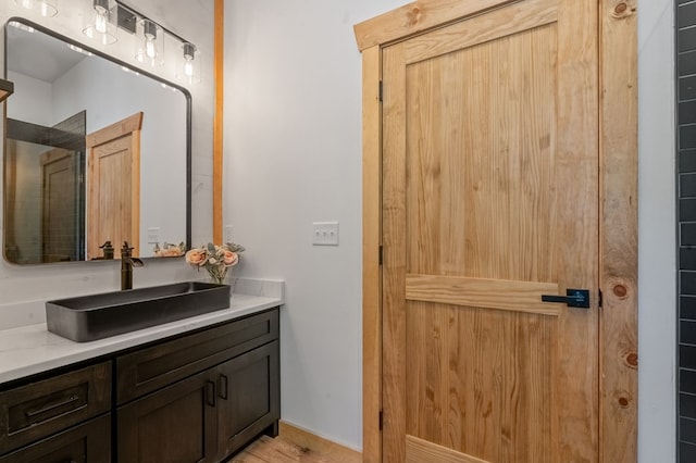 bathroom featuring vanity and hardwood / wood-style flooring