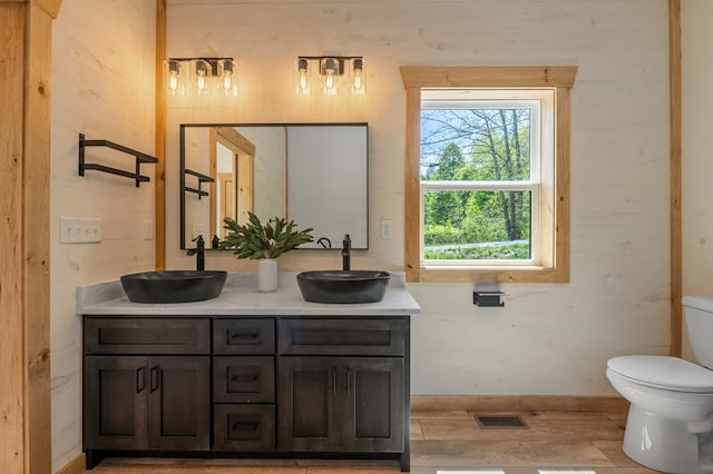 bathroom featuring hardwood / wood-style floors, vanity, and toilet