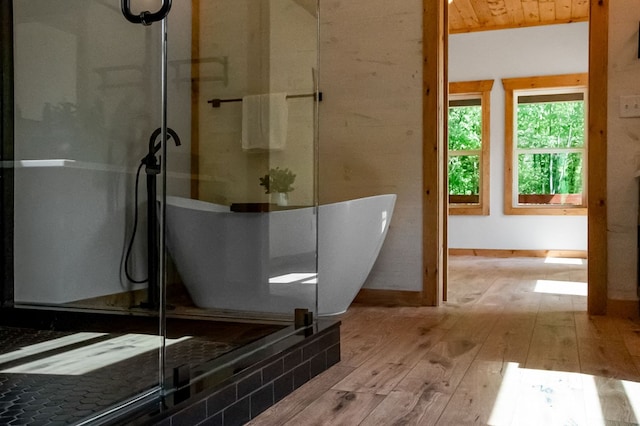 bathroom with wood-type flooring and wood ceiling