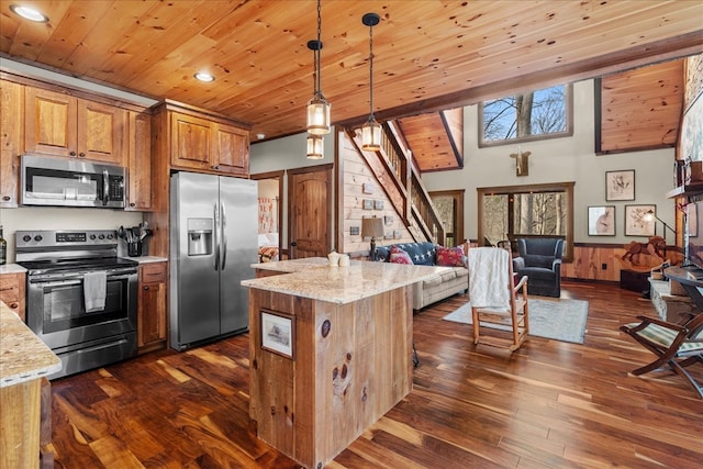 kitchen featuring wood ceiling, brown cabinets, and appliances with stainless steel finishes