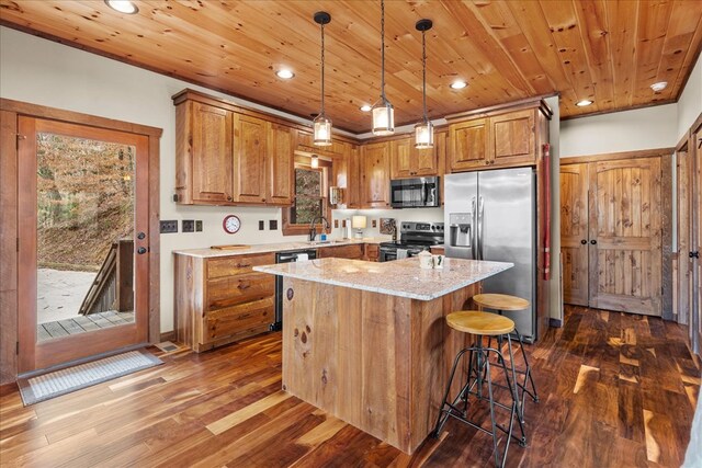 kitchen with wood ceiling, brown cabinetry, appliances with stainless steel finishes, and a sink