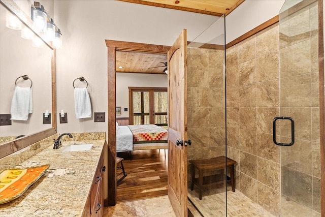 full bathroom with a shower stall, wooden ceiling, vanity, and ensuite bathroom