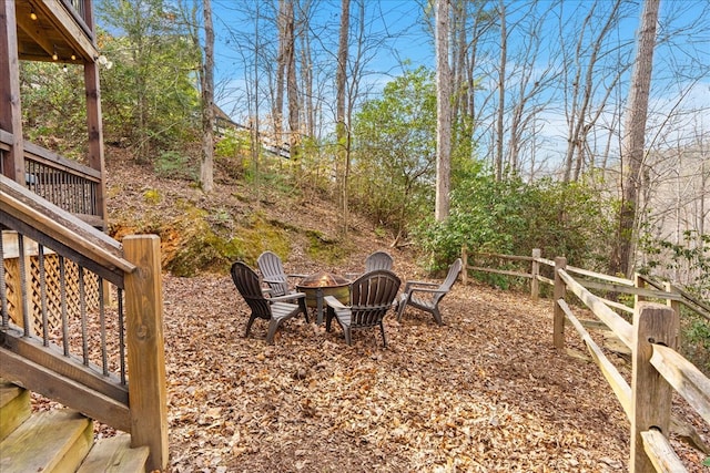 view of yard with a fire pit