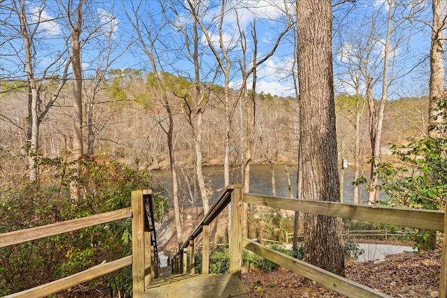 exterior space with a wooded view