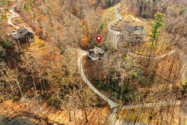 birds eye view of property with a forest view