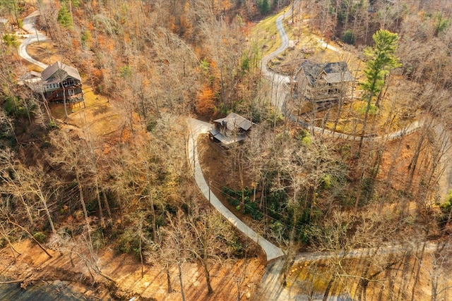 birds eye view of property featuring a view of trees