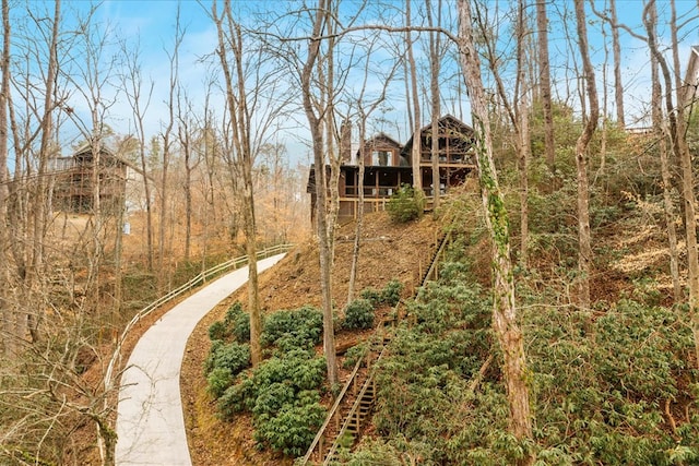 view of yard with a wooded view