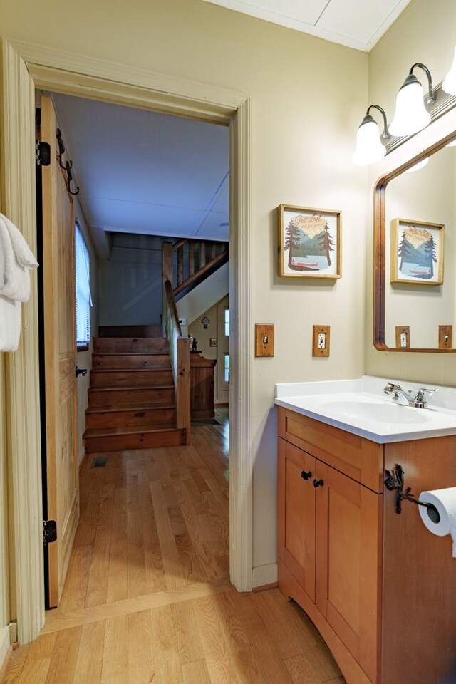 bathroom with vanity and hardwood / wood-style flooring