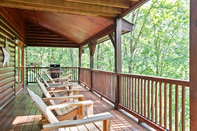 wooden deck featuring area for grilling