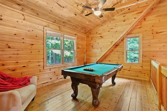 recreation room with billiards, ceiling fan, wood walls, and light wood-type flooring